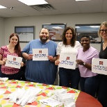 Office employees gather to enjoy an ice cream social for National Roofing Week!