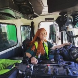 Driver employee inside truck cabin