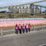 Female ZGC team members posing with BIG HOPE 1 in the name of cancer awareness